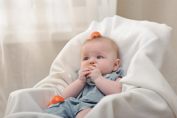 Little boy in the chair and with eggshell