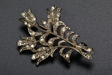 Brooch in form of the golden plant with diamonds. Bijouterie