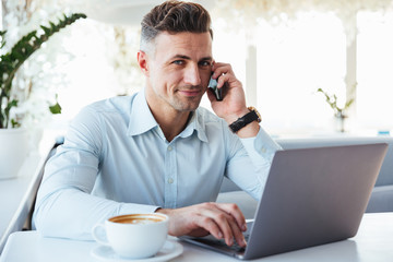 Portrait of a smiling mature man talking on mobile phone