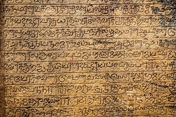 Ancient sanskrit writing on tablet - close up - obrazy, fototapety, plakaty