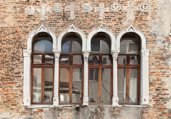 Fototapeta na wymiar ancient Windows with reflection, Venetia, Italy