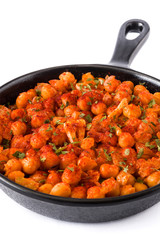 Fried spicy chickpeas in frying pan isolated on white background
