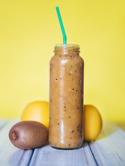 fresh smoothies in a glass jar with Apple and kiwi