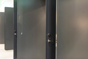 Grey open doors to a big hallway