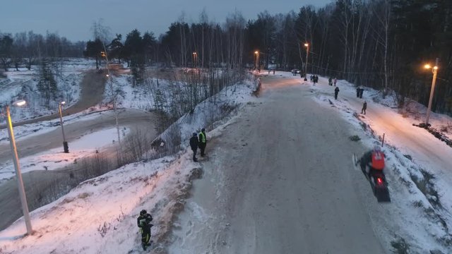 Russian Championship on snowmobiles January 27, 2018: Winter racing on snowmobiles. Aerial view: Snowmobile on the route in a jump. Action from snowmobile races.