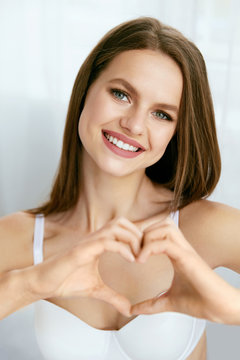 Beautiful Girl Showing Heart With Hands