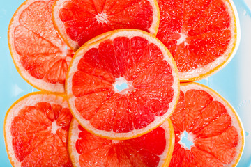 Grapefruit slice in the water. Top view.
