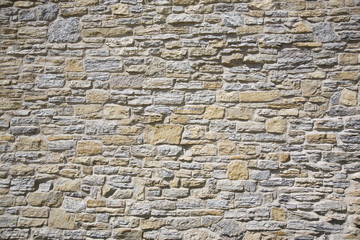 Old stone wall made of limestone and sandstone