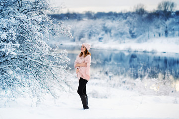 Beautiful woman enjoys the snow. A fabulous winter. Christmas holiday. All in the snow.