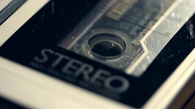 Retro music tape with cassette spinning.