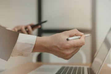 businesman analyze financial chart in smartphone. man working with startup project. business adviser inspecting market plan report at workplace.