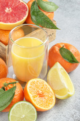 Fresh citruses and juice. Lemons, limes, clementines, grapefruit