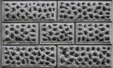 Detail shot of a grey concrete 3d wall tiles for background, high resolution, real photo
