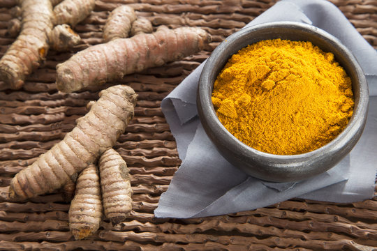 Turmeric spice on the wooden table