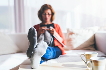 Senior woman relaxing at home.