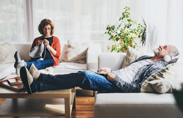 Senior couple relaxing at home.