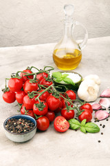 Ripe tasty red tomatoes with salt and basil. Village market organic tomatoes and garlic. Fresh tomato