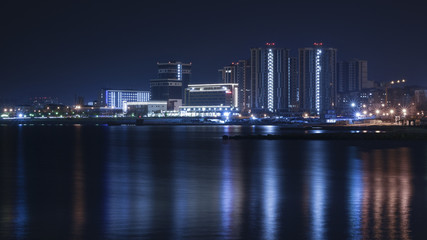 Fototapeta na wymiar Night view of the quay of the Cheron Sea in Novorossiysk, Russia.