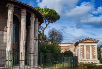 Fototapeta na wymiar Ancient roman temples of Hercules Victor and Portunus in Foro Boarium square in the historic center of Rome