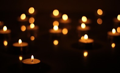 Abstract background with flames and reflections of burning candles