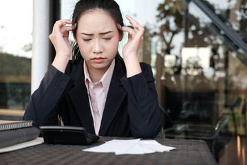 woman calculate domestic bills. Businesswoman using calculator at modern office. Young female checking balance & costs.  Startup counting finance for paying taxes. stressful, frustrated, upset concept