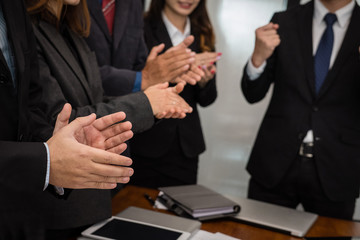cheerful businessman applauding at conference. successful business team clapping hands for great work