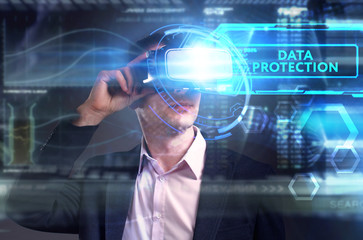Business, Technology, Internet and network concept. Young businessman working on a virtual screen of the future and sees the inscription: Data protection