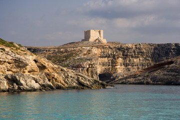 Fototapeta na wymiar Comino Tower And Cliffs, Malta