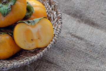 persimmon fresh close up on background.