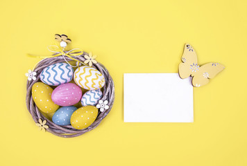 Creative easter composition with painted eggs.