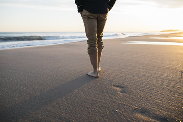 walking on beach at sunset - 192341644