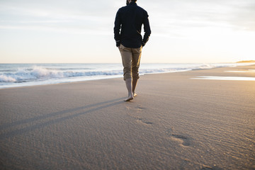walking on beach at sunset - 192342837