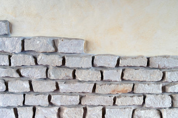 Mauer / Mauer mit Steinen und glatter Fläche
