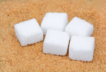 Fototapeta na wymiar Brown sugar with white sugar cubes