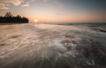 Sunset seascape at Kudat Sabah Malaysia. With wave trails.