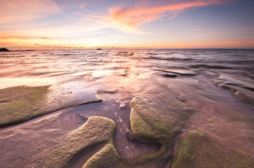 Sunset seascape at Kudat Sabah Malaysia. With natural coastal rocks.