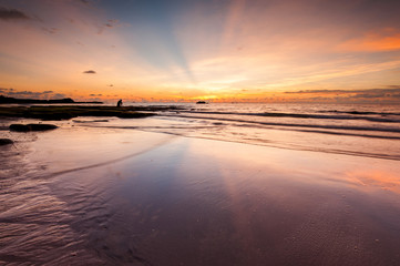 seascape with ray of light and reflection. image contain soft focus and blur due to long expose.