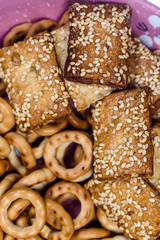 biscuits with sesame seeds and small bagels photographed macro