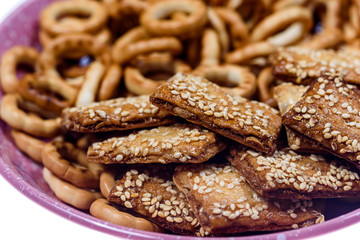 biscuits with sesame seeds and small bagels photographed macro