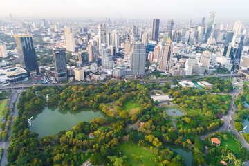 Fototapeta premium Modern city downtown of Bangkok with green public park