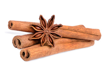 Cinnamon sticks with star anise on white background