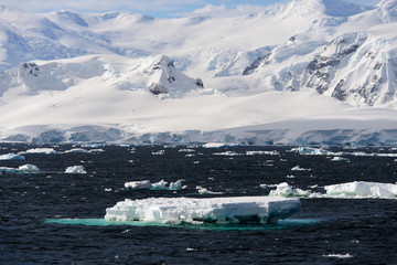 Antarctic landscape with iceberg