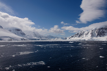 Antarctic landscape with sea and mountains