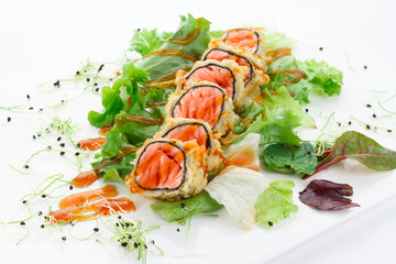 Salmon tempura roll over white background.