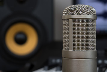 Professional studio monitor and condenser microphone. Concept of home music studio.