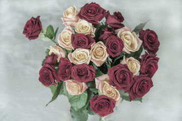 Bouquet of roses of pastel toned colors for beloved, top view, symbol of love, romantic celebrations
