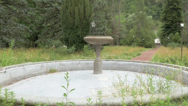 Around the ancient fountain in the park at Romanov Palace - Borjomi, Georgia