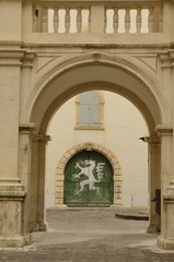 Wooden green door in Landhaus courtyard in Graz, Austria