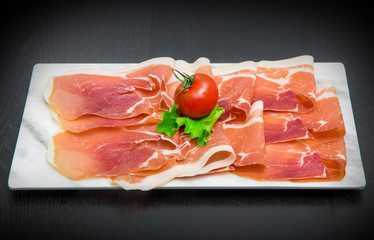 marble dish with raw ham