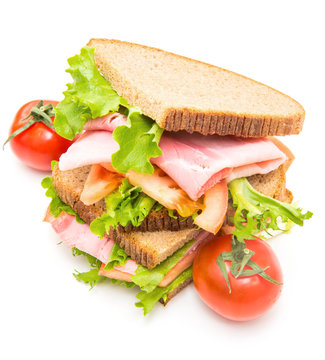 sandwiches with ham, saladf and tomatoes
